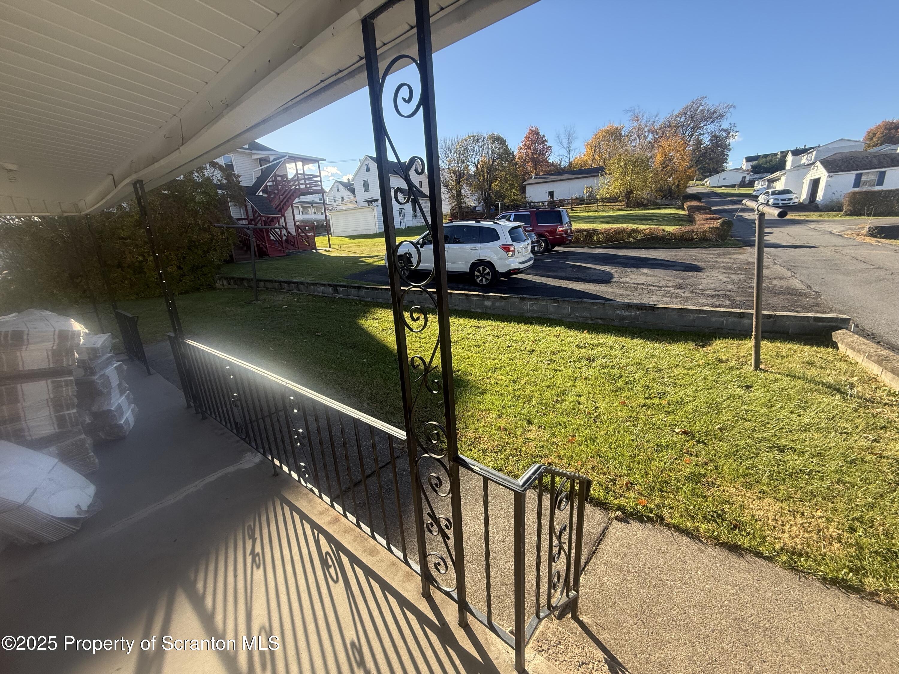 662 Simpson Street Throop, PA 18512 - Photo 8 of 9 a view of a swimming pool with a patio