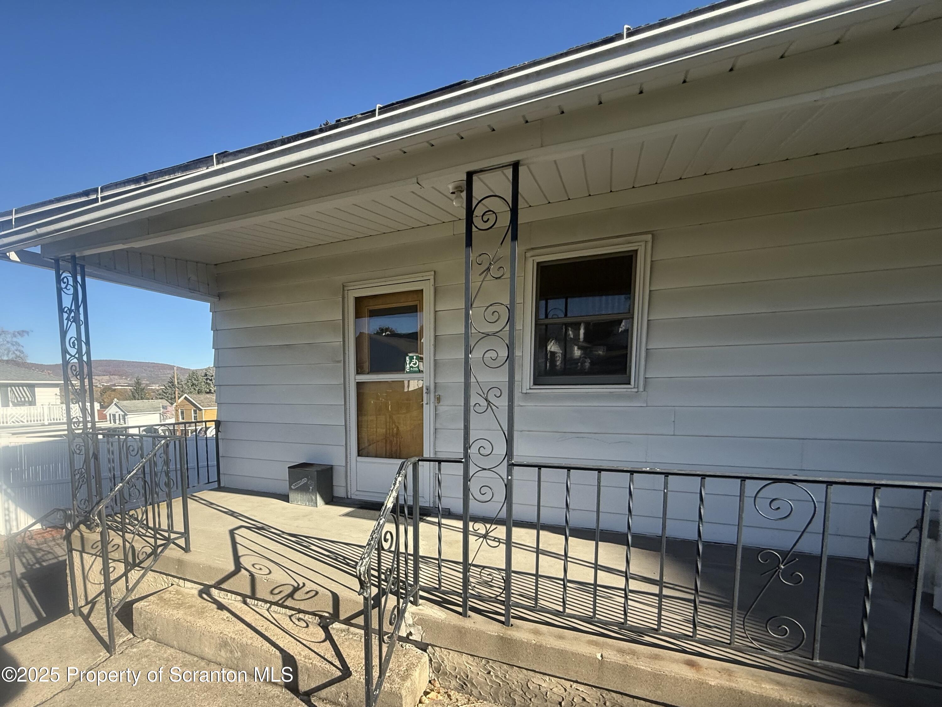 662 Simpson Street Throop, PA 18512 - Photo 9 of 9 a view of a balcony with chairs