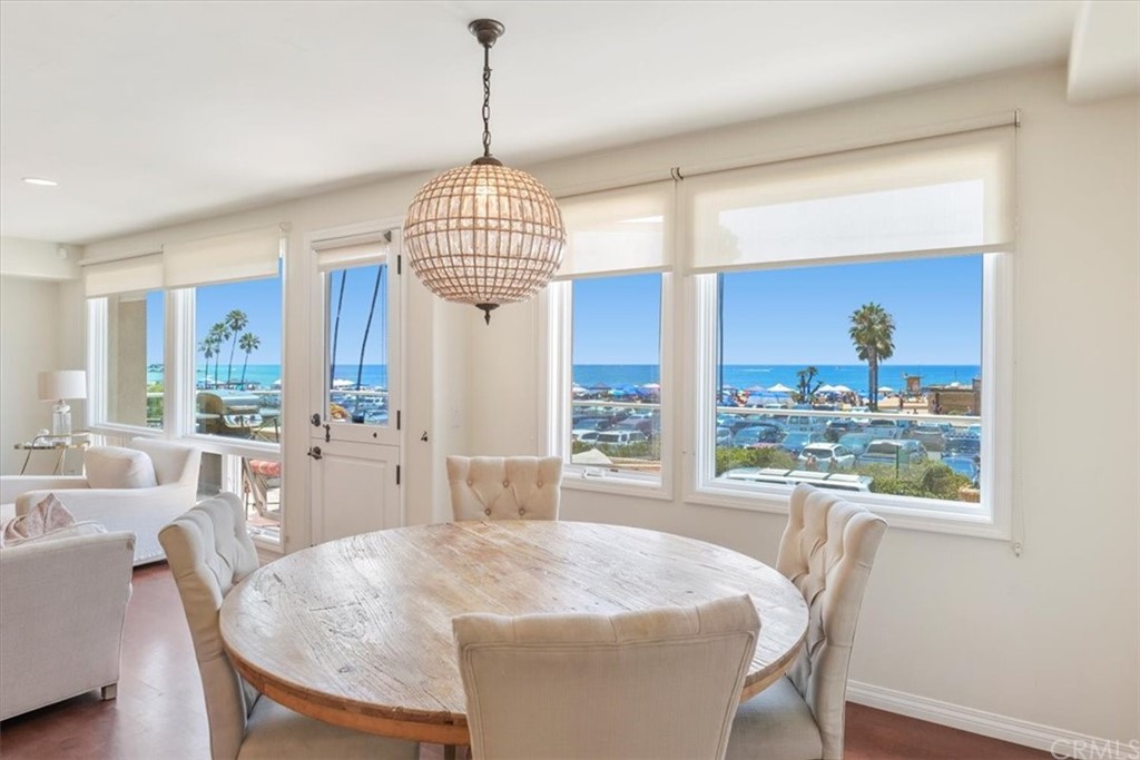 3036 Breakers Drive Corona del Mar, CA 92625 - Photo 2 of 48 a view of a dining room with furniture wooden floor and chandelier