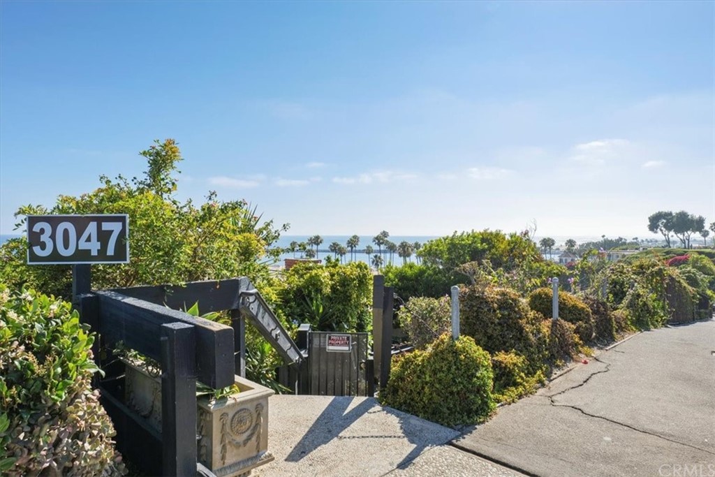 3036 Breakers Drive Corona del Mar, CA 92625 - Photo 22 of 48 a view of a street with a building in the background