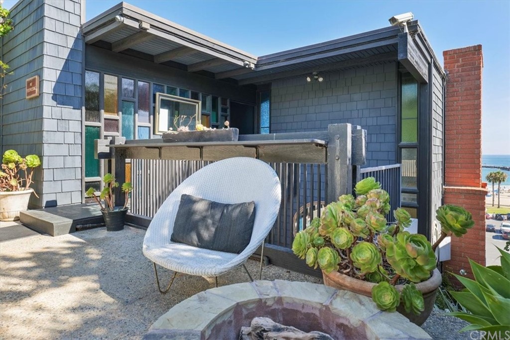3036 Breakers Drive Corona del Mar, CA 92625 - Photo 25 of 48 a front view of a house with outdoor seating