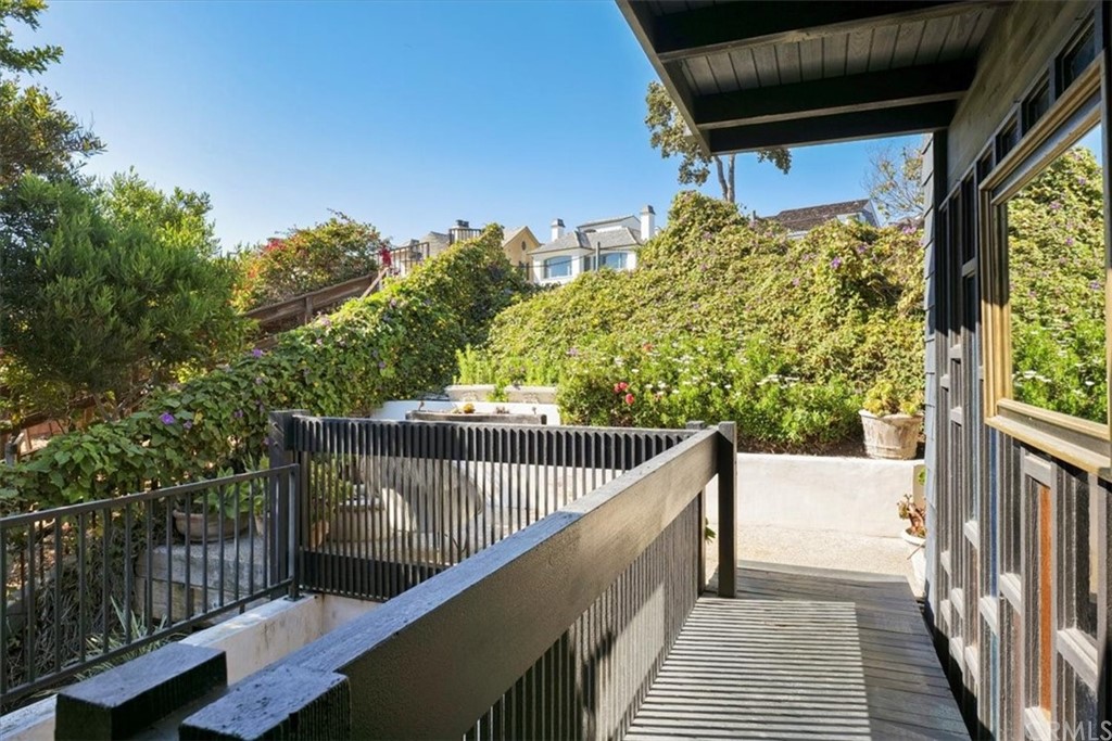 3036 Breakers Drive Corona del Mar, CA 92625 - Photo 26 of 48 a balcony with trees in front of it