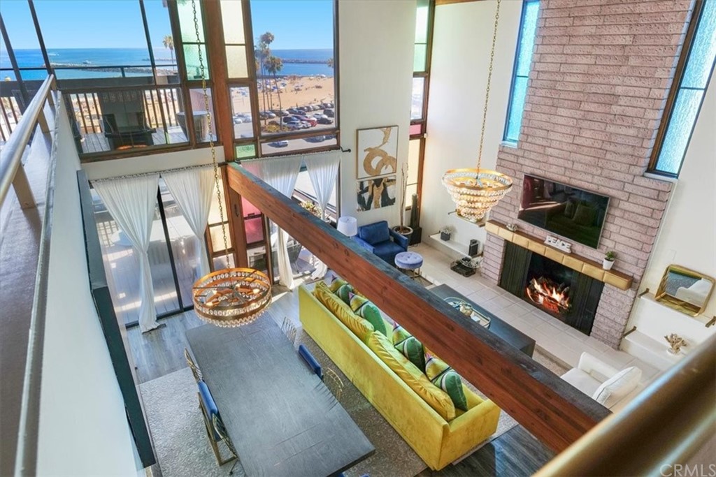 3036 Breakers Drive Corona del Mar, CA 92625 - Photo 29 of 48 a living room with furniture and a fireplace