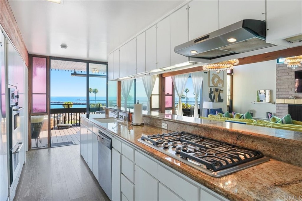 3036 Breakers Drive Corona del Mar, CA 92625 - Photo 32 of 48 a large kitchen with lots of counter space