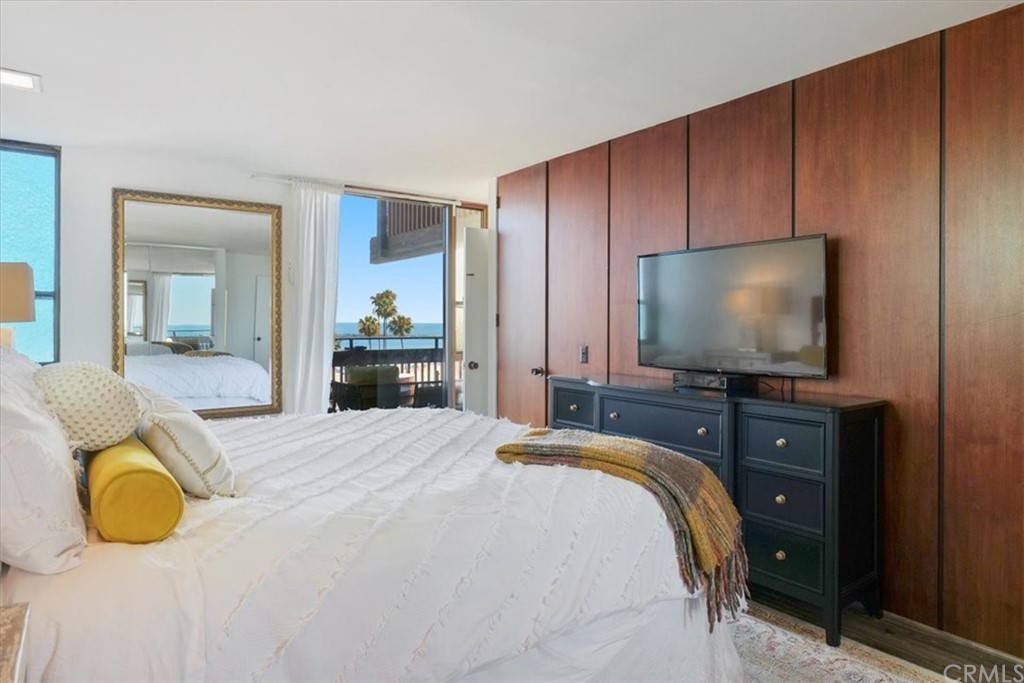 3036 Breakers Drive Corona del Mar, CA 92625 - Photo 34 of 48 a bedroom with a bed and flat screen tv