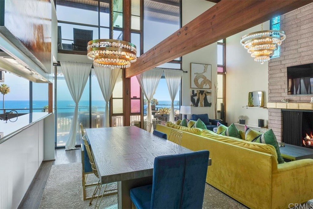 3036 Breakers Drive Corona del Mar, CA 92625 - Photo 35 of 48 a view of a dining room with furniture a chandelier and wooden floor