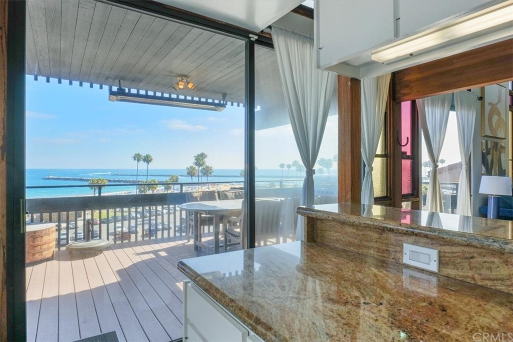 3036 Breakers Drive Corona del Mar, CA 92625 - Photo 36 of 48 a view of a balcony with furniture and wooden floor