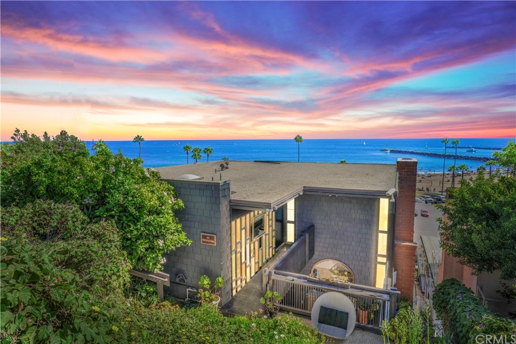 3036 Breakers Drive Corona del Mar, CA 92625 - Photo 5 of 48 a front view of a house with a yard