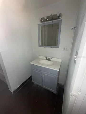 a bathroom with a sink toilet and vanity