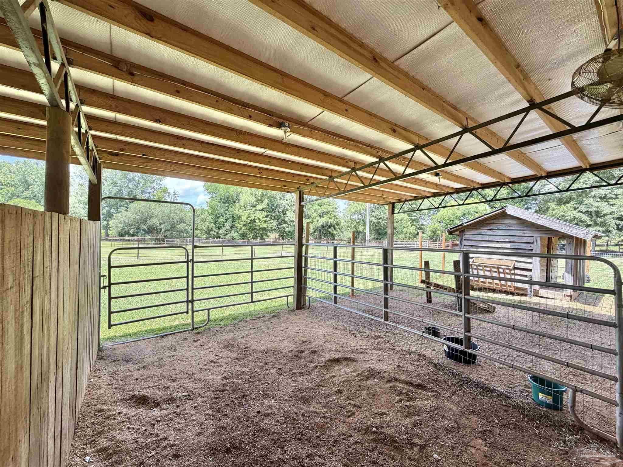 145 Tower Road Uriah, AL 36480 - Photo 39 of 72 a view of a backyard with wooden floor and roof