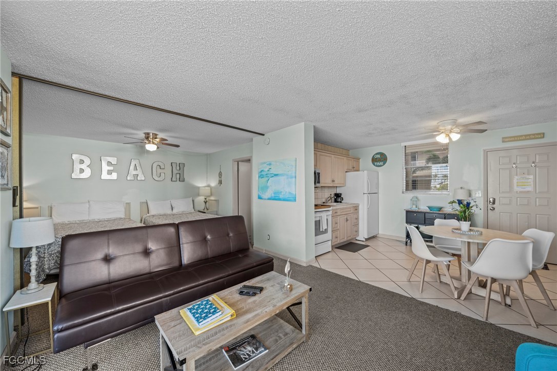 5600 Bonita Beach Road Southwest, Unit 204 Bonita Springs, FL 34134 - Photo 3 of 23 a living room with furniture