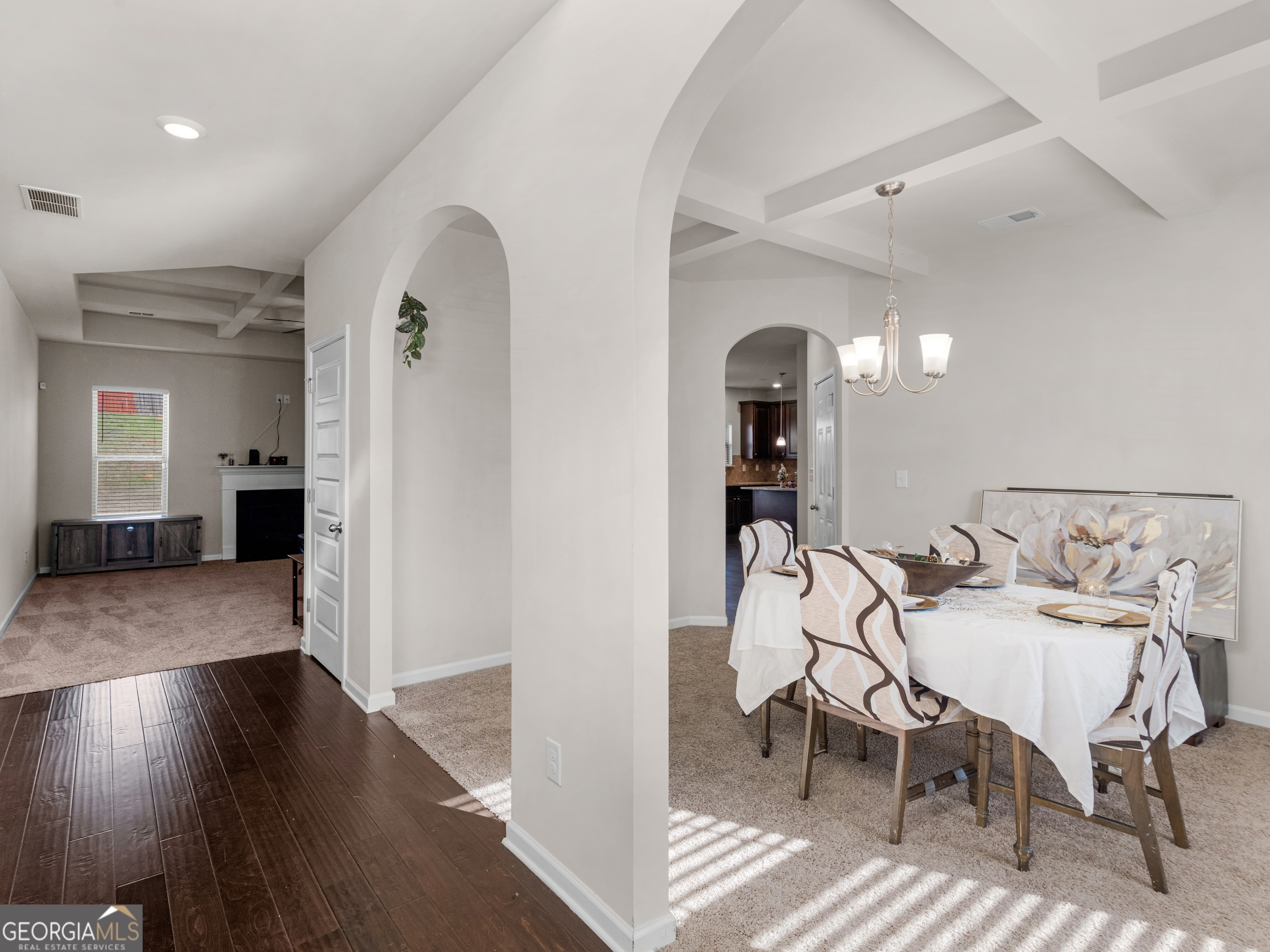 630 Oakville Trail Hampton, GA 30228 - Photo 15 of 36 a view of a dining room with furniture and wooden floor