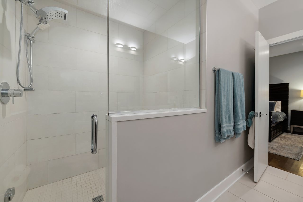 1224 West Ohio Street, Unit 2E Chicago, IL 60642 - Photo 12 of 17 a bathroom with a shower