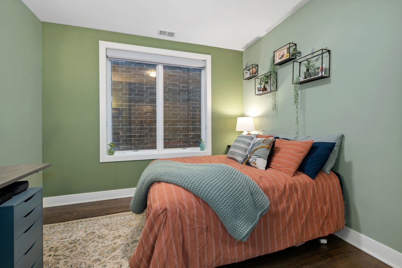 1224 West Ohio Street, Unit 2E Chicago, IL 60642 - Photo 13 of 17 a bedroom with a bed and window