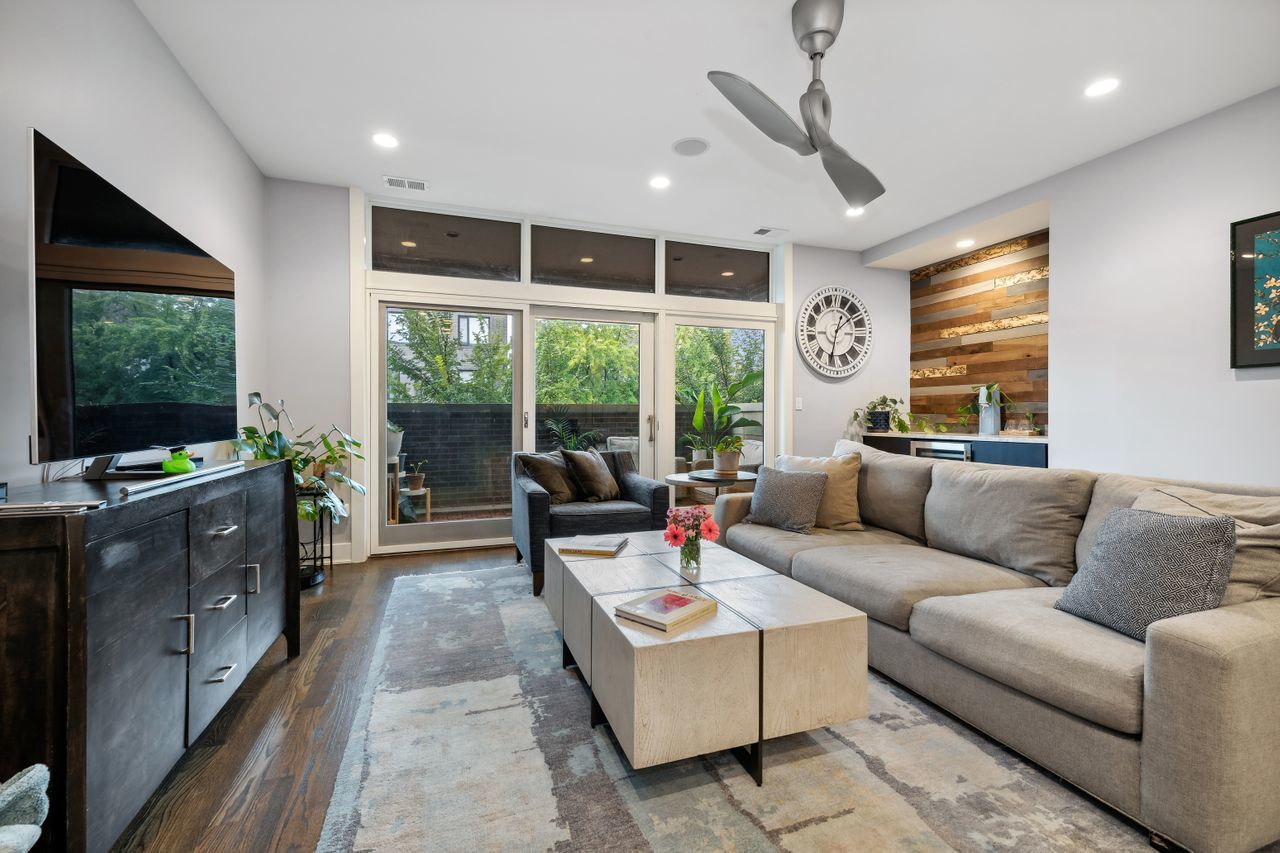 1224 West Ohio Street, Unit 2E Chicago, IL 60642 - Photo 2 of 17 a living room with furniture tv and a window