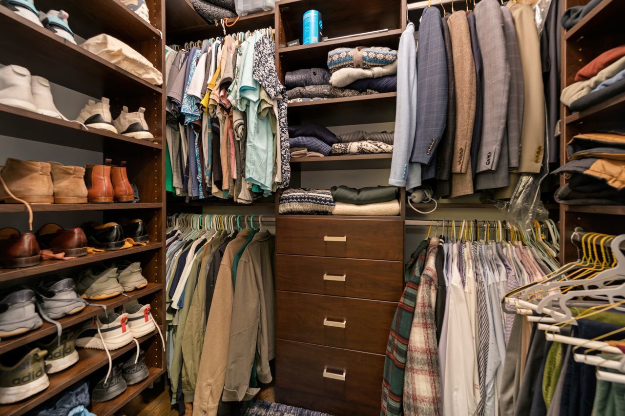 1224 West Ohio Street, Unit 2E Chicago, IL 60642 - Photo 10 of 17 a view of walk in closet with clothes and shoes