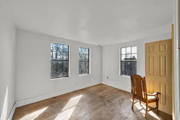 a view of a livingroom with furniture and windows