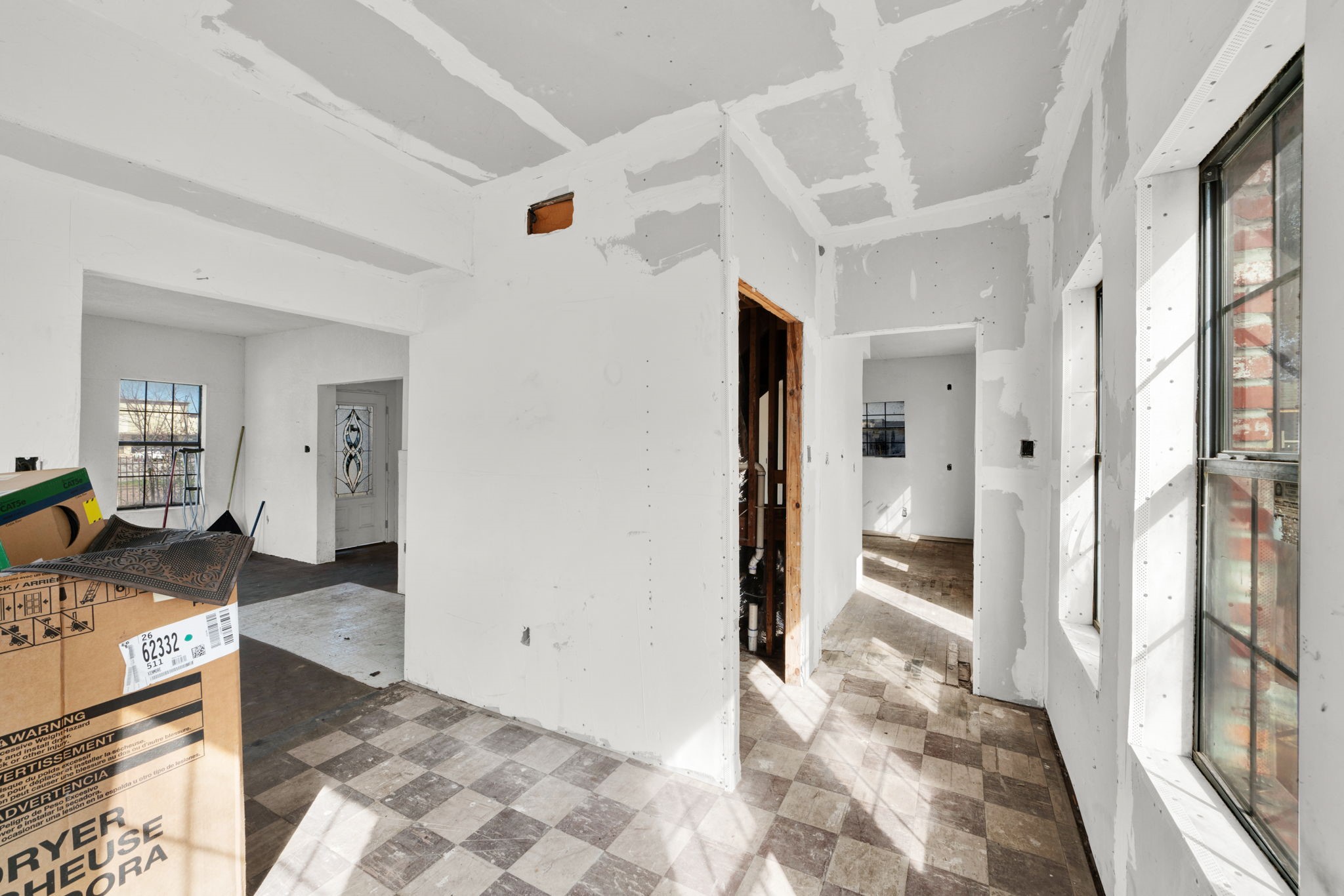 3727 Broadway Street Houston, TX 77017 - Photo 23 of 43 a view of a hallway to a livingroom with wooden floor and furniture
