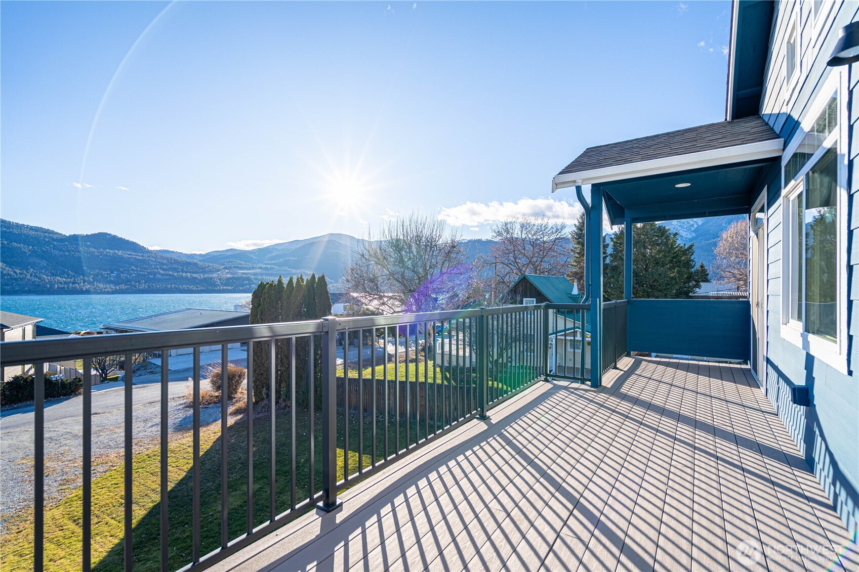 744 Wapato Way, Unit A Manson, WA 98831 - Photo 16 of 32 a view of a balcony with wooden floor