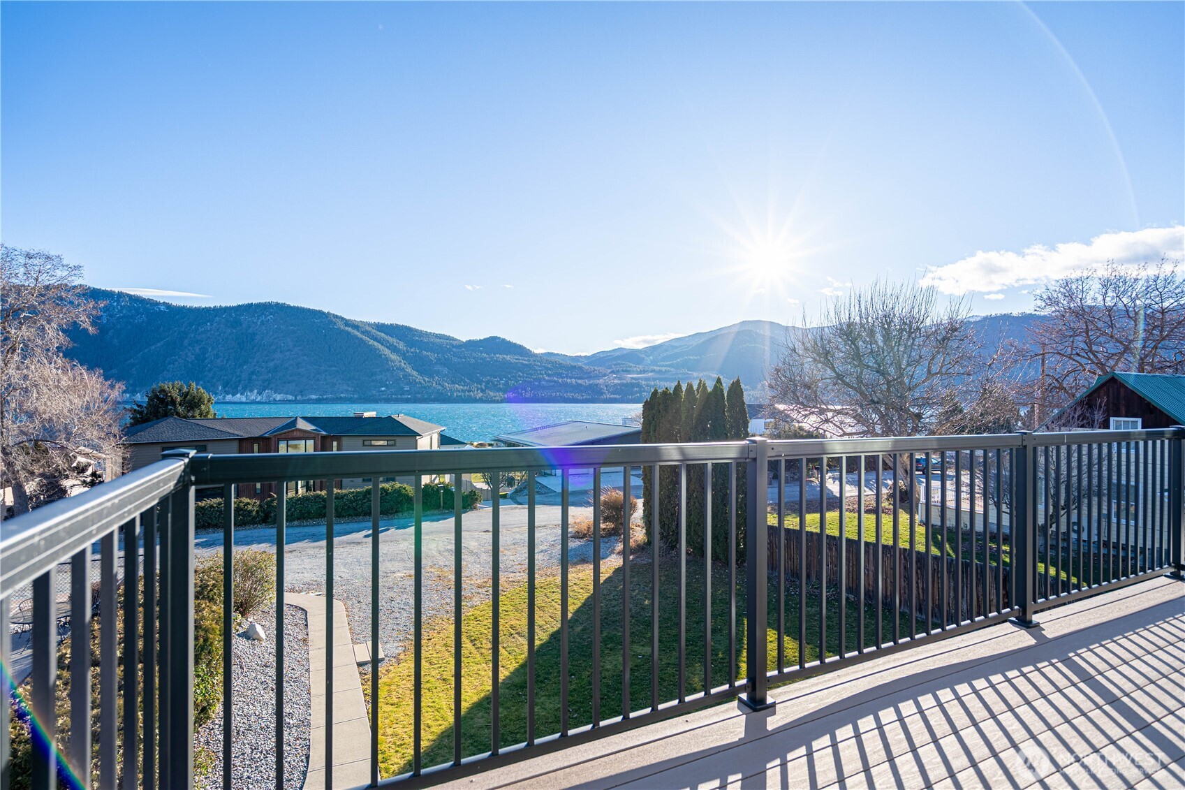 744 Wapato Way, Unit A Manson, WA 98831 - Photo 17 of 32 a view of a houses from a balcony