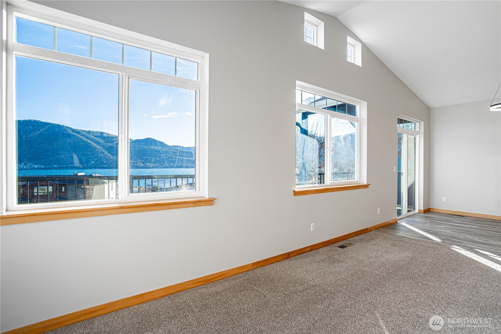 744 Wapato Way, Unit A Manson, WA 98831 - Photo 6 of 32 a view of an empty room with a window