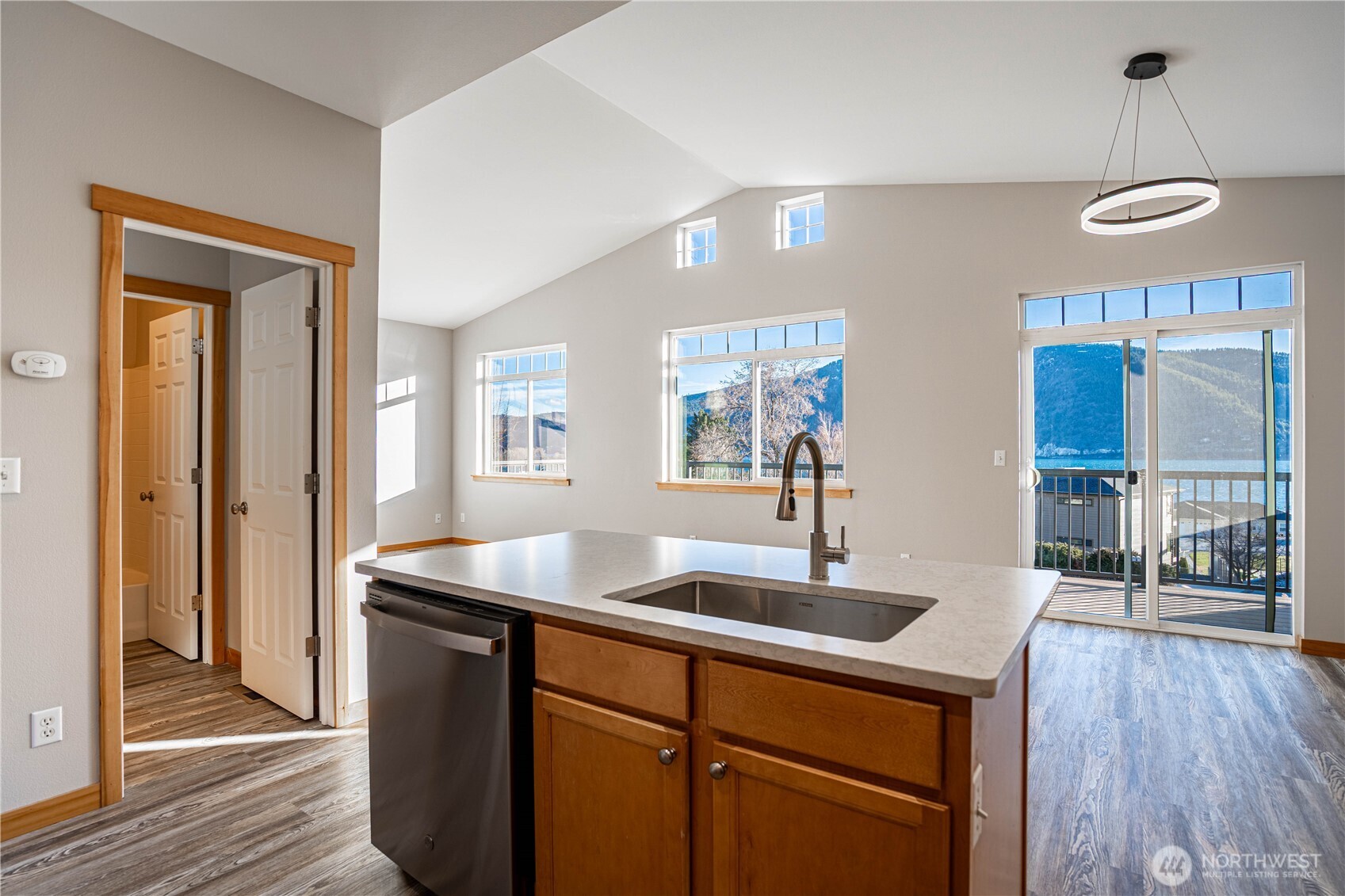 744 Wapato Way, Unit A Manson, WA 98831 - Photo 9 of 32 a kitchen with stainless steel appliances granite countertop a sink a refrigerator and a granite counter tops