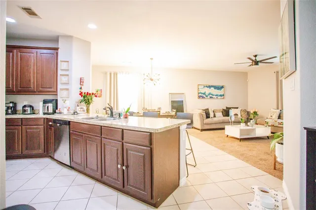 a spacious bathroom with a granite countertop sink and a large mirror