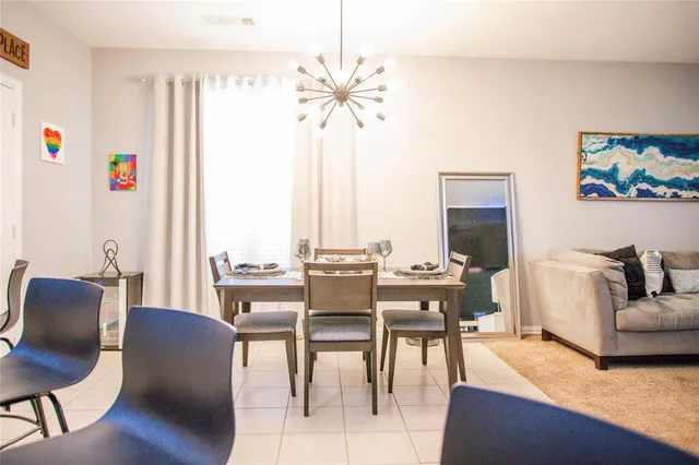 a kitchen with kitchen island granite countertop a table and chairs