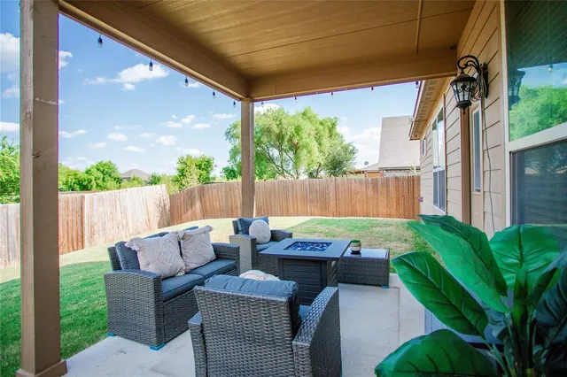 a outdoor living space with furniture and a potted plant