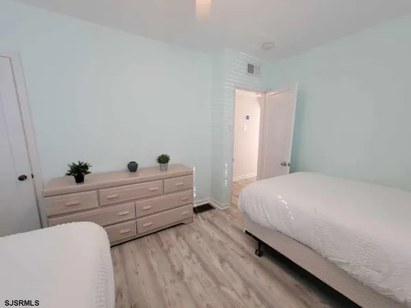 a bed room with a bed and a window