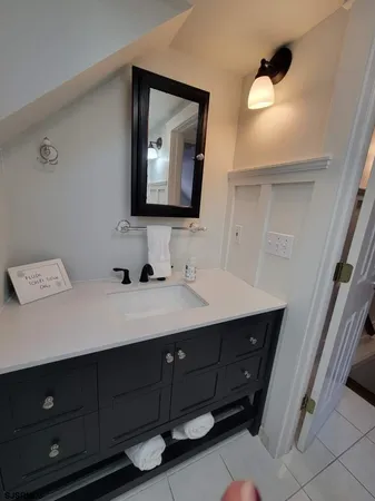 a bathroom with a double vanity sink and mirror