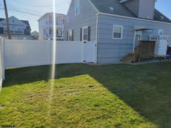 a view of a backyard of the house