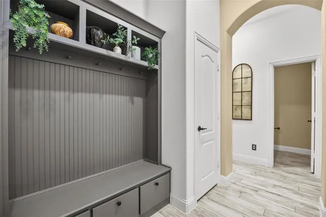 a bedroom with a bed and ceiling fan