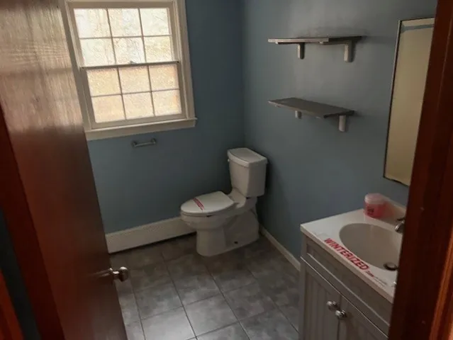 a bathroom with a toilet sink and tub