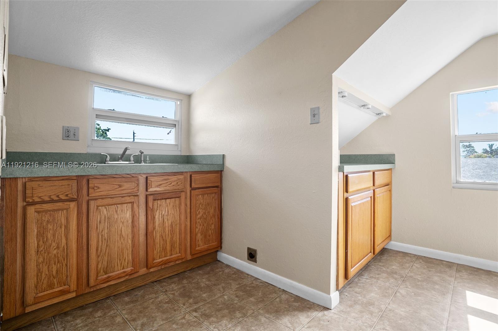 212 Southwest 11th Street Dania Beach, FL 33004 - Photo 25 of 39 a bathroom with a granite countertop sink and a mirror