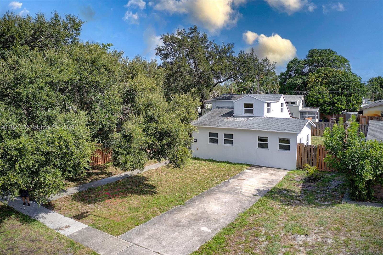 212 Southwest 11th Street Dania Beach, FL 33004 - Photo 30 of 39 a view of a house with a yard