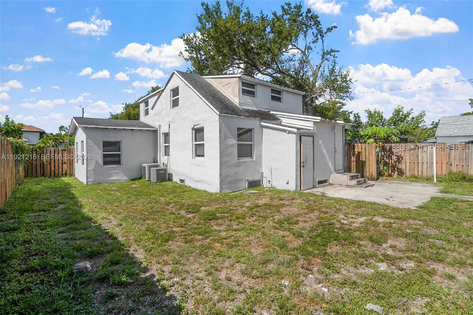 212 Southwest 11th Street Dania Beach, FL 33004 - Photo 31 of 39 a view of a house with yard and a garden