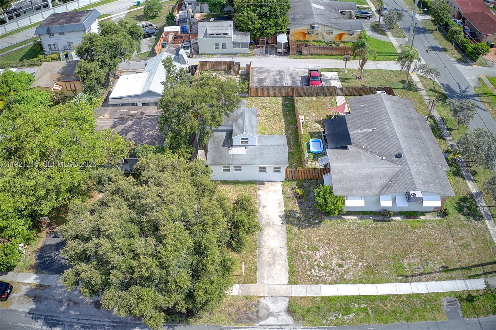 212 Southwest 11th Street Dania Beach, FL 33004 - Photo 33 of 39 an aerial view of a house with a yard basket ball court and outdoor seating