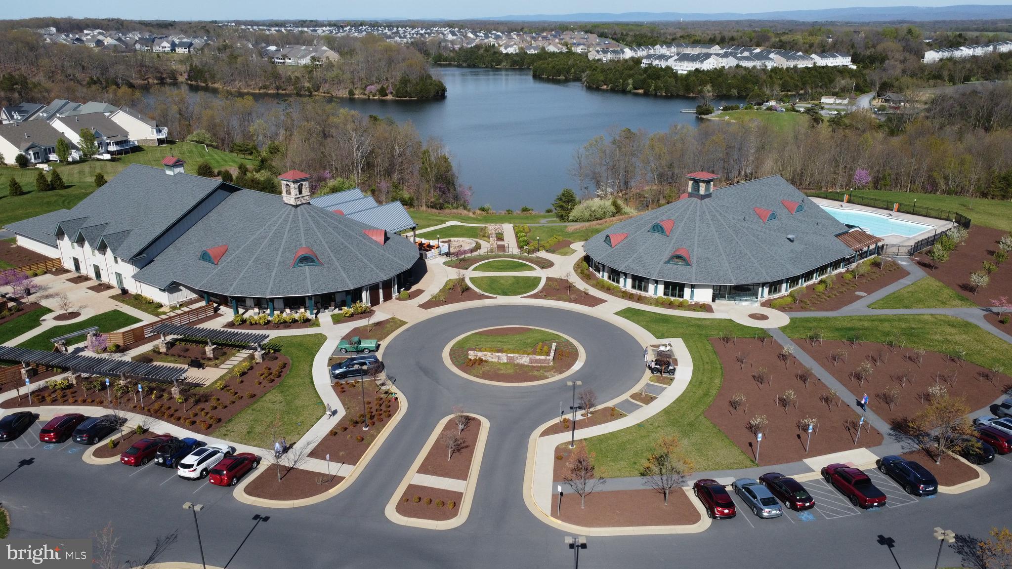 113 Atlantis Lane Front Royal, VA 22630 - Photo 48 of 58 View of the lake and clubhouse at Trilogy