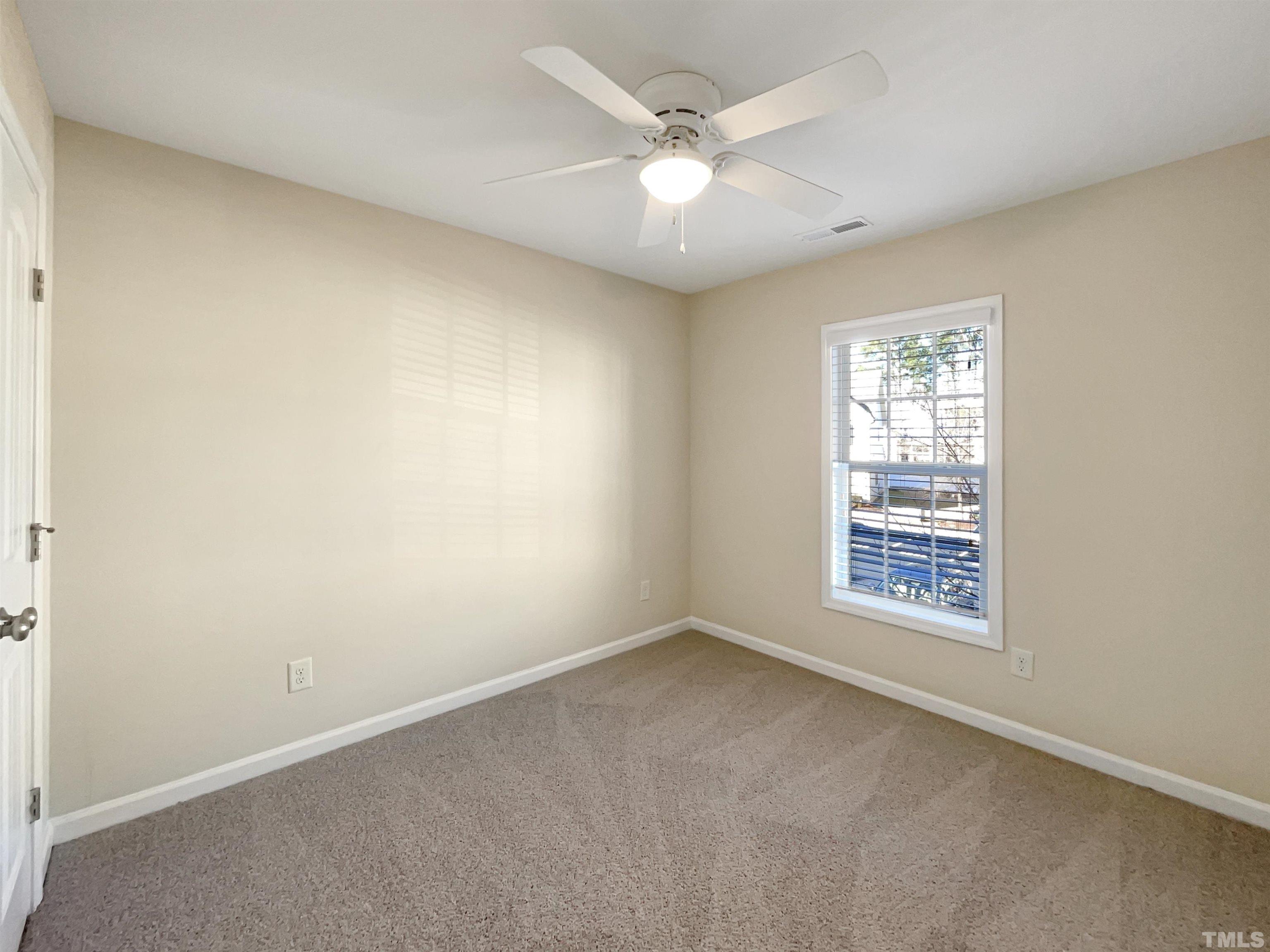 3240 Warm Springs Lane Raleigh, NC 27610 - Photo 16 of 18 an empty room with a window
