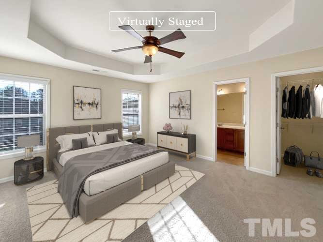 3240 Warm Springs Lane Raleigh, NC 27610 - Photo 3 of 18 a spacious bedroom with a bed and a view of bathroom