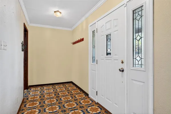 a view of hallway with wooden floor