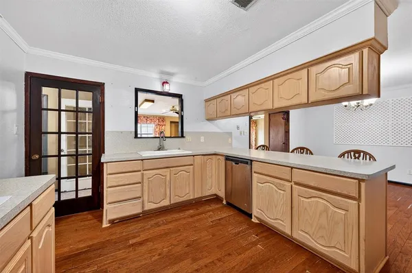 a dining room with furniture and wooden floor