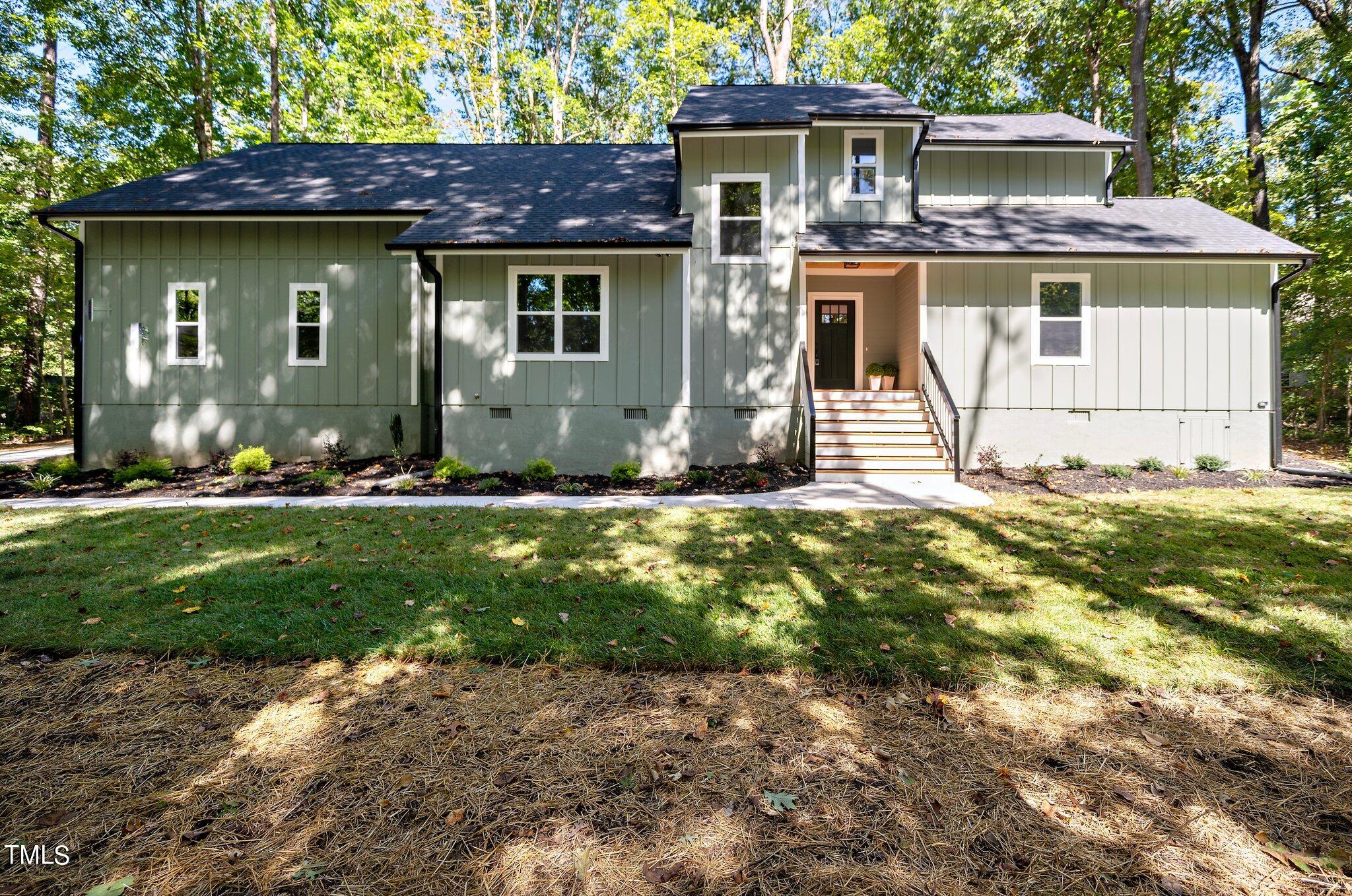 8112 Rhudy Place Raleigh, NC 27612 - Photo 2 of 39 a front view of a house with a yard