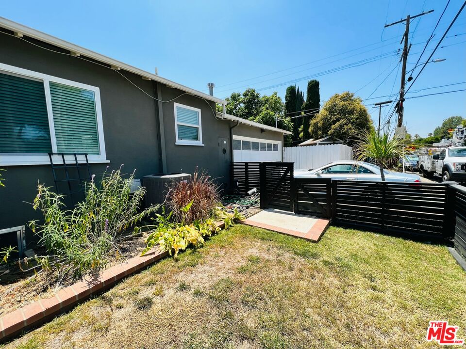 5757 Vesper Avenue Van Nuys, CA 91411 - Photo 17 of 18 a view of a backyard with chairs and potted plants
