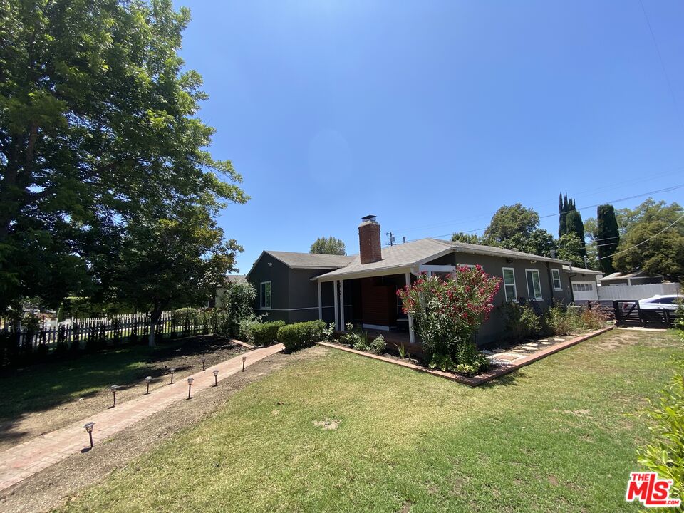 5757 Vesper Avenue Van Nuys, CA 91411 - Photo 18 of 18 a view of a house with backyard porch and sitting area