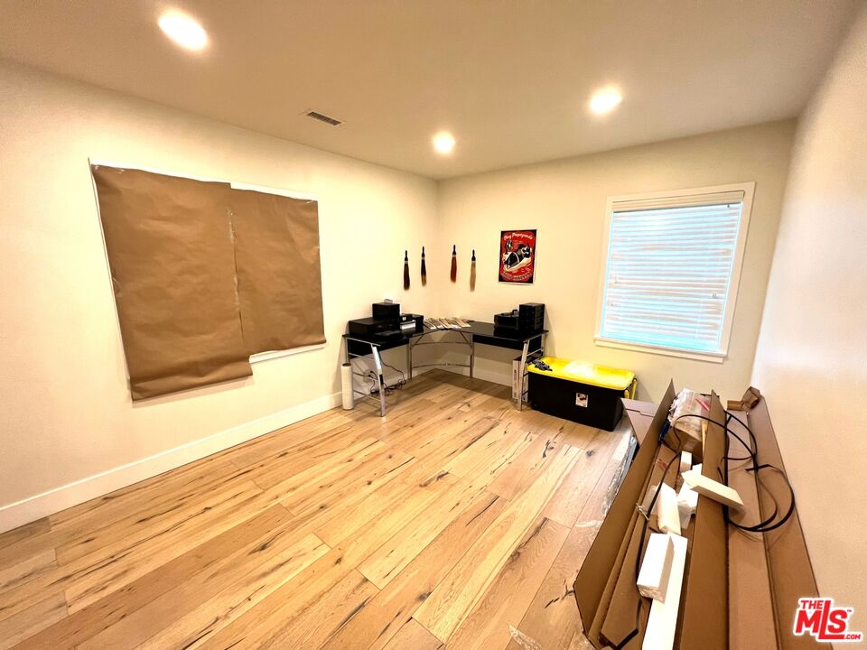 5757 Vesper Avenue Van Nuys, CA 91411 - Photo 9 of 18 a living room with furniture and a flat screen tv