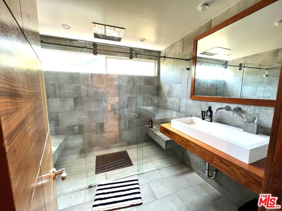 5757 Vesper Avenue Van Nuys, CA 91411 - Photo 10 of 18 a bathroom with a sink and a mirror