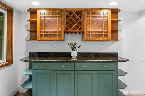 a kitchen with a sink and cabinets