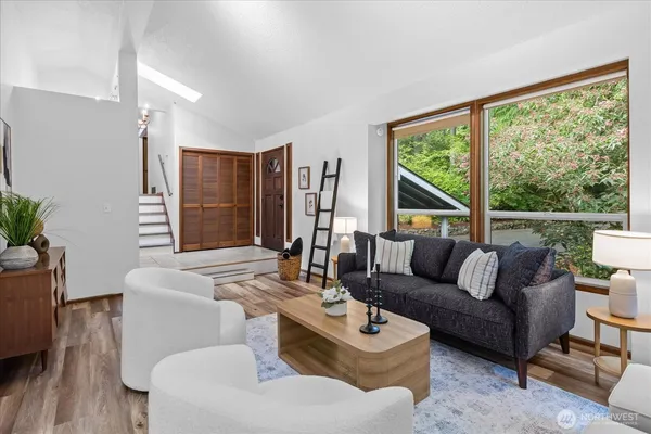 a living room with furniture and a large window